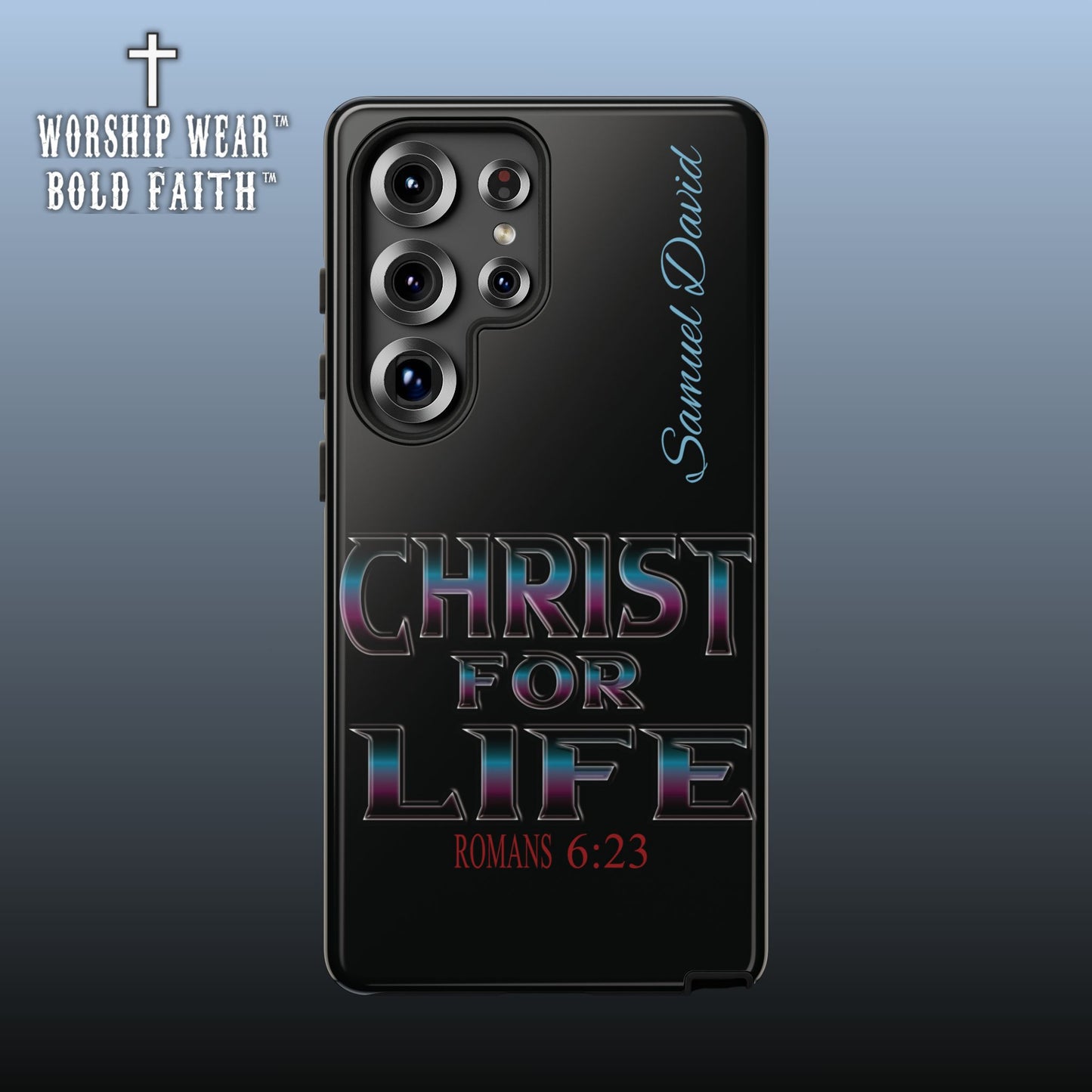 A black phone case featuring a religious design, shown on a smartphone. The design includes the text 'CHRIST FOR LIFE' in a metallic, iridescent-style font, 'ROMANS 6:23' in red at the bottom, and 'Samuel David' in light blue script on the right side.
